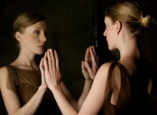 Woman Looking at Reflection